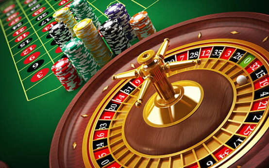 Roulette wheel and casino chips on the table.Similar images: